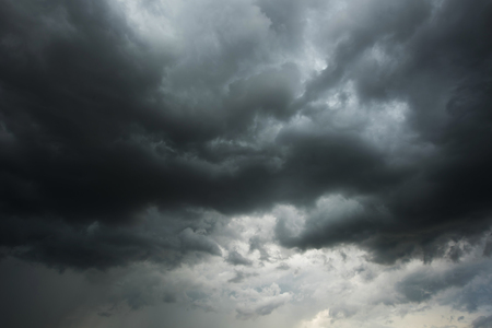 Dark sky and black clouds before rainy, Dramatic black cloud and thunderstormの写真素材
