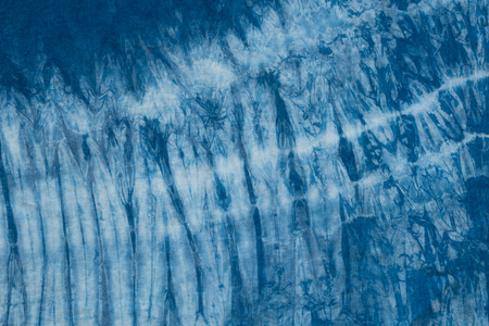 Pattern of blue dye on cotton cloth, Dyed indigo fabric background and texturedの写真素材