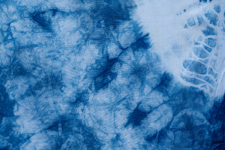 Pattern of blue dye on cotton cloth, Dyed indigo fabric background and texturedの写真素材