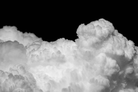 Close-up cumulus clouds isolated on black background, Black sky with white cloudsの写真素材
