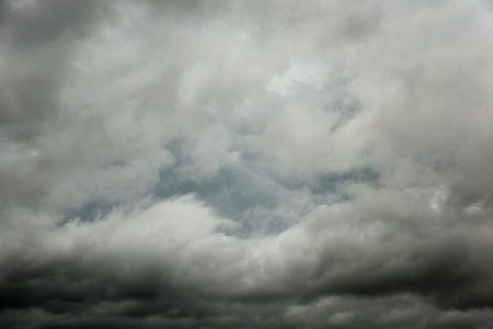 Closeup black clouds and motion, Dark sky with thunderstorm before rainy の写真素材