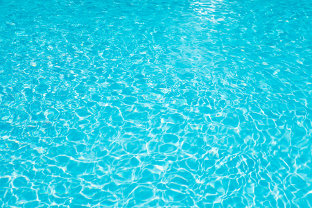 Beautiful ripple wave and blue water surface in swimming pool, Blue water for background and abstractの写真素材