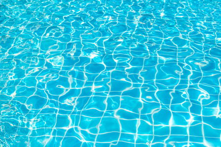 Blue and bright ripple water and surface in swimming pool , Beautiful motion gentle wave in poolの写真素材