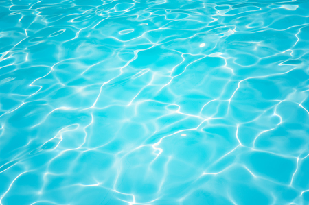 Beautiful ripple wave and blue water surface in swimming pool, Blue water surface for backgroundの写真素材