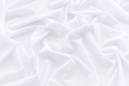 White fabric background and texture, Crumpled of white satin for abstract and designの写真素材