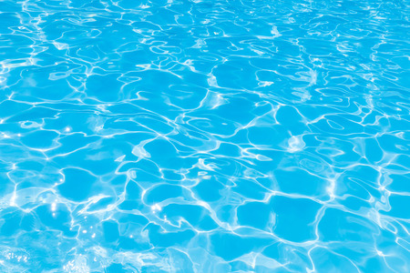 Wonderful blue and bright ripple water and surface in swimming pool, Beautiful motion gentle wave in poolの写真素材