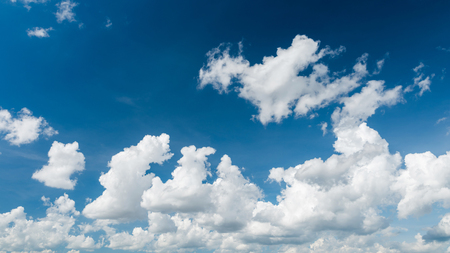 Wonderful white cumulus clouds on blue skyの写真素材