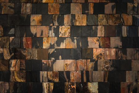 Dark stone wall background and textureの写真素材