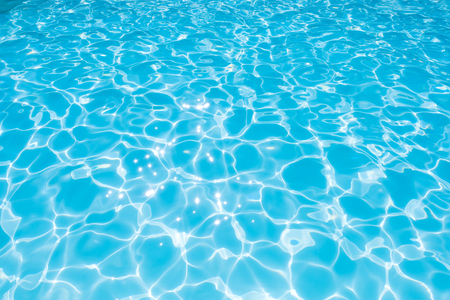 Beautiful ripple wave and blue water surface in swimming pool, Blue water for background and abstractの写真素材