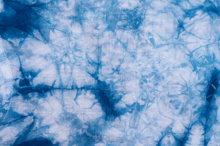 Pattern of blue dye on cotton cloth, Dyed indigo fabric background and texturedの写真素材