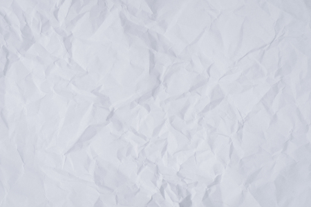 White crumpled paper background and textureの写真素材
