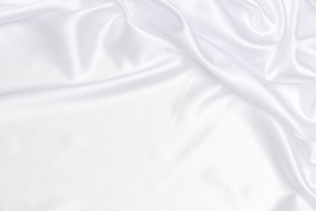 Crumpled of white satin backgroundの写真素材