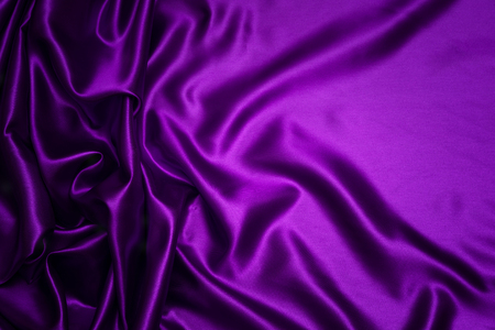 Abstract purple drapery cloth, Wave of dark violet fabric background, Pattern and detail grooved fabric for background and abstractの写真素材