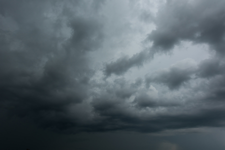 Dark clouds and thunderstorm with rainy, Dramatic  black clouds in summerの写真素材