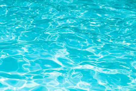 Beautiful ripple wave and blue water surface in swimming pool, Blue water for background and abstractの写真素材