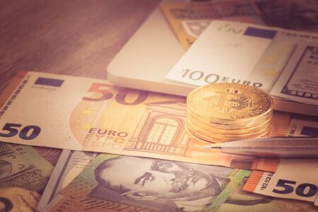 Bitcoin new virtual money with Euro and pen, Pen coin and banknote for business concept vintage tone