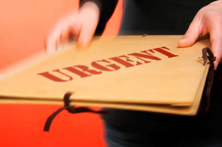 A woman bringing an urgent file.の写真素材