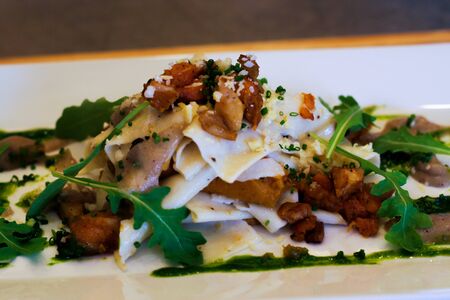 An open faced vegetarian ravioli.の写真素材