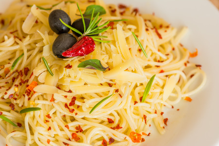 Spaghetti aglio e olio - Spaghetti aglio e olio in white plate.の写真素材