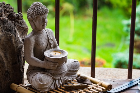 Budha Statue with green backgroundの写真素材