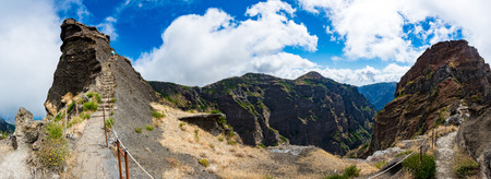Woman traveler at Madeira mountain path between Pico Ruivo and Pico Areeiroの写真素材