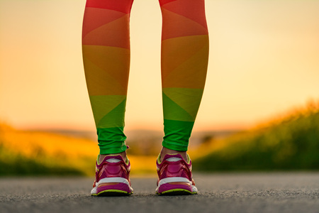 Runner's feet.Runner feet running on road closeup on shoe. woman fitnessの写真素材