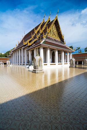 Buddhist temple by day in Thailand. Sacred place for prayingの写真素材