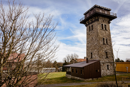 Stone lookout tower in sunny autumn days.の写真素材
