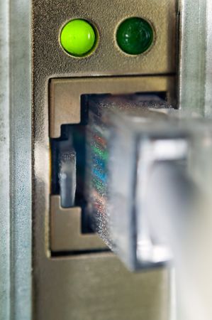 An extreme closeup of the LAN connector plugged into an network interface cardの写真素材