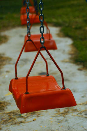 A red swing in the park