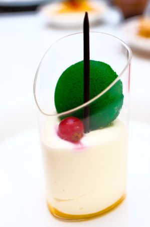 Mango mousse dessert in a glass cupの写真素材