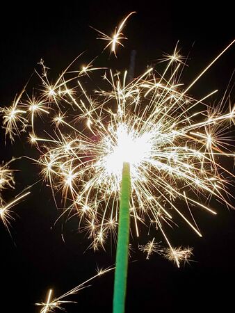 Lit Sparkler with starburst lightsの写真素材