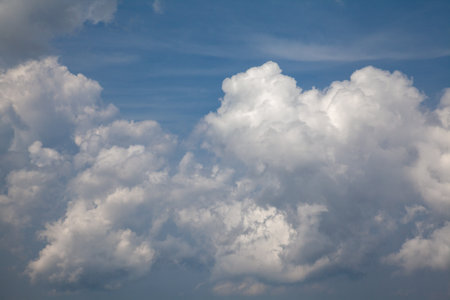 sky, sunlit clouds, white and blue cloudsの写真素材