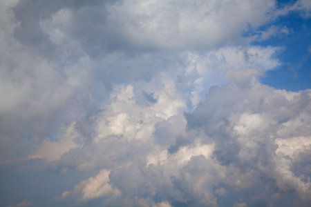 sky, sunlit clouds, white and blue cloudsの写真素材