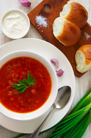 A dish of Ukrainian national cuisine is red borscht. food background top view.