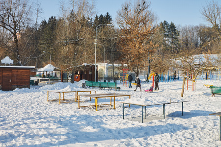 People walk winter, sunny day