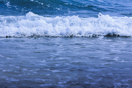 In front of water wave at the beach