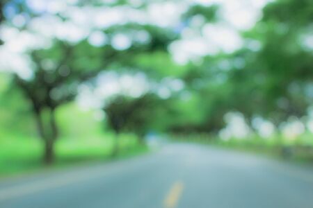the blurred tree and road in nature, blurred nature abstract backgroundの写真素材