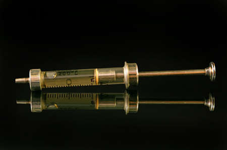 Syringes old glass model on a black backgroundの写真素材