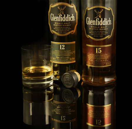 Glenfiddich Single Malt Scotch whiskey on black background. Valley of the deer. Whiskey is a major...