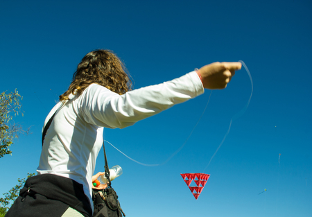 Middle Age Woman playing with a Tetrahedral Strange Kiteの写真素材