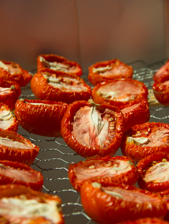 Sun Dried Tomatoes on a simple metal drying trayの写真素材