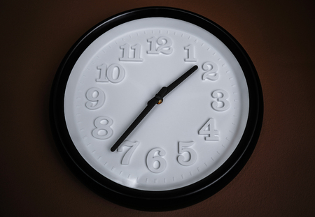 A clock on dark wall