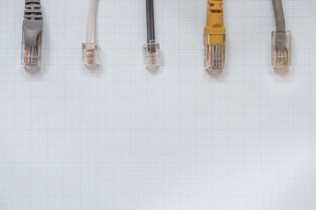 Network cables for connecting computers to the internet on a millimeter background