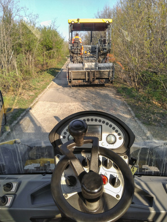 Kladovo, Serbia - April 01, 2019: The view from the asphalt ascent roller in front of it is visible...
