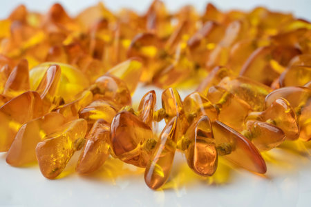 Macro close up of amber necklace on white backgroundの写真素材