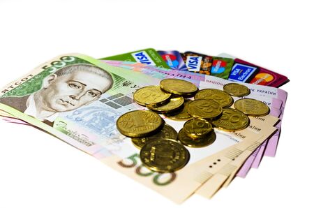 Credit cards, paper money and coins on white background  Ukrainian money 