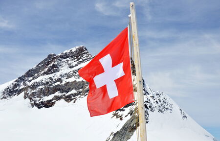 switzerland flag on Jungfrau mountainの写真素材