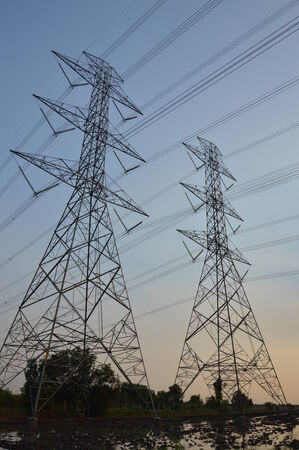 high voltage poles in the eveningの写真素材