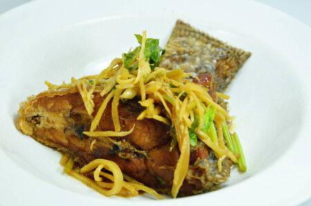 fried fish fillets soy bean and topping with slice ginger